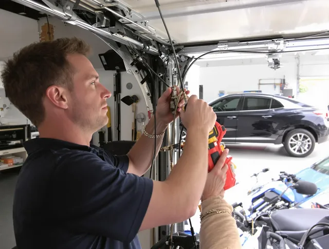 Cimarron Hills Garage Door Repair safety certified technician performing cable replacement in Cimarron Hills